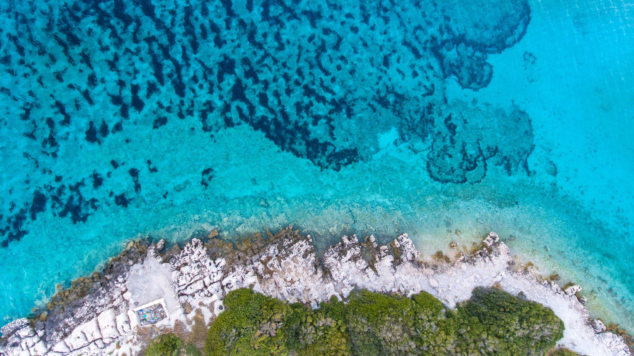 Aerial shot of a beautiful blue lagoon beach